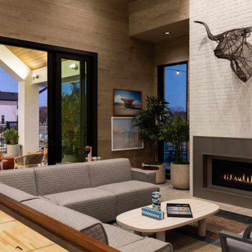 an amenity club room living room and fireplace for residents of a build-to-rent community