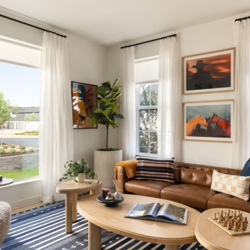 a build-to-rent townhome living room with large windows and furniture