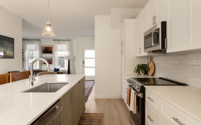 A light, bright kitchen in a townhome of a build-to-rent community
